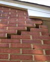 Serious damage to a foundation wall due to settlement of a home in Gardiner