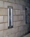 an inside view of foundation wall anchors installed along a basement wall to brace and repair the structure in Scarborough