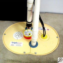 A sump pump system installed along a basement floor in Portland.