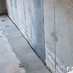an ugly basement weeping tile drainage system that's clogged and not working in Dover.