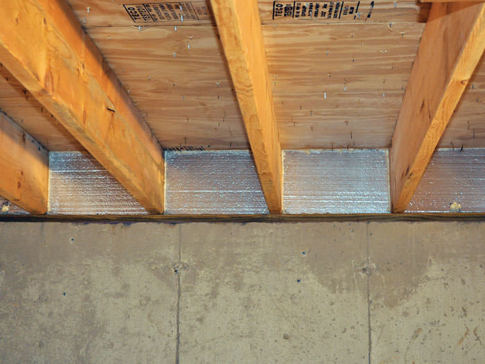 Crawl E Insulation With Silverglo In Bangor Portland Rochester Silverglo Insulation Installed In A Floor Joist Scarborough