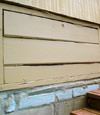 an old-fashioned crawl space door in Somersworth about to be replaced