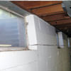 A foundation showing severe inward buckling along the windows in a Sanford home.