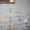 A cracked foundation wall near a window in a Houlton home