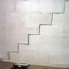 A diagonal stair step crack along the foundation wall of a Windham home
