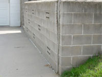 A retaining wall separating from the adjoining walls in Exeter