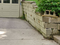 a failing retaining wall around a driveway in Portland