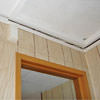 The ceiling and wall separating as the wall sinks with the slab floor in a Windham home