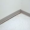 A partition wall separating from the floor in a Bath home.