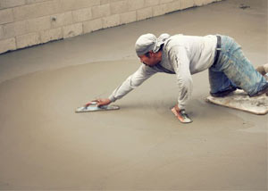 smoothing out the grout in a slab releveling project in Waterville