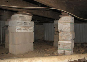 crawl space repairs done with concrete cinder blocks and wood shims in a Windham home