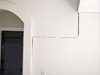 Drywall cracking due to foundation settlement in Gardiner