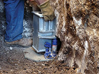 Securing a foundation footing bracket for a foundation repair system in Saco.