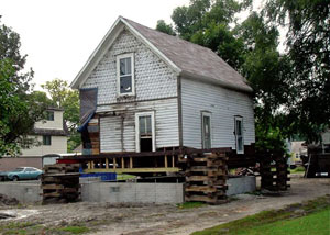 A severely damaged home foundation that is undergoing replacement in Houlton.