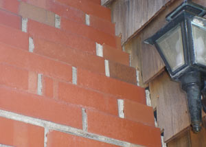 a repaired chimney in Yarmouth that had shown serious foundation damage and was repaired with a helical pier system.