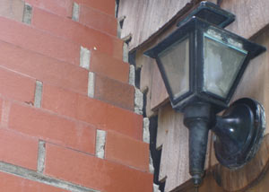 A tilting chimney in Yarmouth showing serious foundation damage.