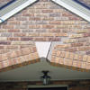Major tuckpointing on a home archway over a door, with tuckpointing several inches wide that has failed on a Portland home