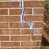 Tuckpointing that cracked due to foundation settlement of a Bangor home