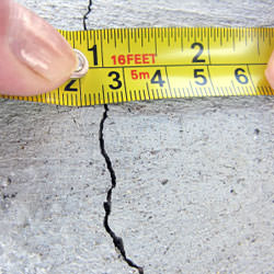 A crack in a poured concrete wall that's showing a normal crack during curing in Falmouth