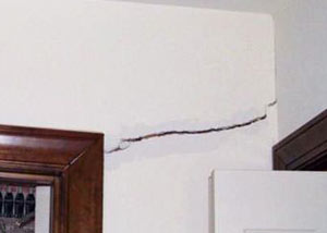 A large drywall crack in an interior wall in Dover