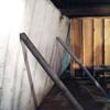 Temporary foundation wall supports stabilizing a Portsmouth home