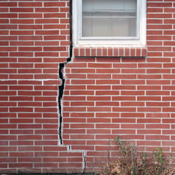A foundation with a large crack that's wider at the top than on the bottom in Skowhegan