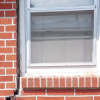 A gap in a window along the outer wall due to foundation settlement of a Westbrook home.