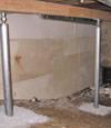 A system of crawl space support posts adding structural support to a crawl space in Falmouth