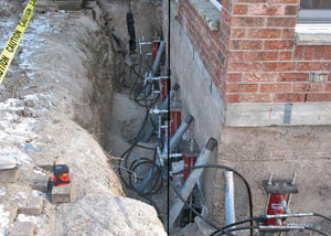 Foundation push piers installed around a house with a foundation settlement issues in Skowhegan