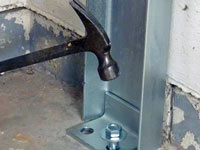 Mounting a foundation channel anchor installation to the floor in Waterville.