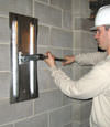 Tightening a wall anchor plate in Portsmouth, Maine