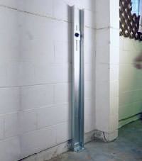 A failing foundation wall repaired with a foundation wall channel anchor system in a Portsmouth home.