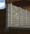 I-beam foundation wall supports installed in a Brunswick basement.