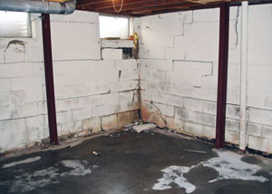 A failed, rusty i-beam foundation wall system installed in Skowhegan.