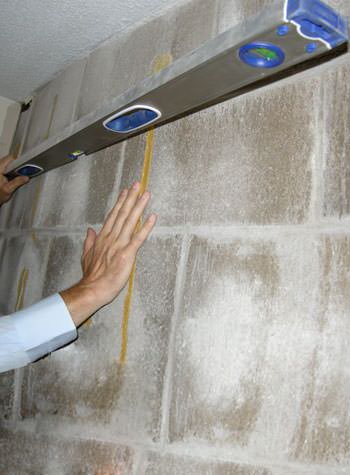 severe foundation wall failure symptoms of a basement wall in Exeter