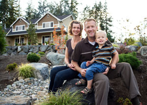 A happy family outside a home with a repaired foundation in Kennebunk