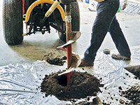 Digging the hole used for wall anchor installation in Somersworth.