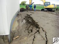 A foundation wall showing severe damage from bowing and buckling in Yarmouth