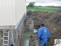 Drilling the hole in the foundation wall for street creep repairs in York