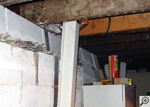 A failing foundation wall and i-beam support in a Portland home