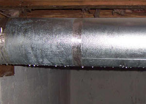 condensation collecting on an HVAC vent in a humid Scarborough basement