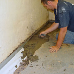 Testing a French drain system in a Brunswick home.