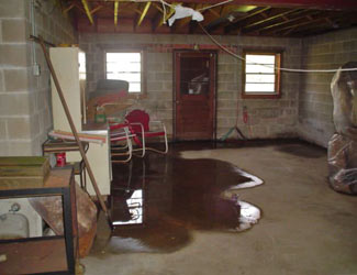 a flooded basement floor in a Falmouth home