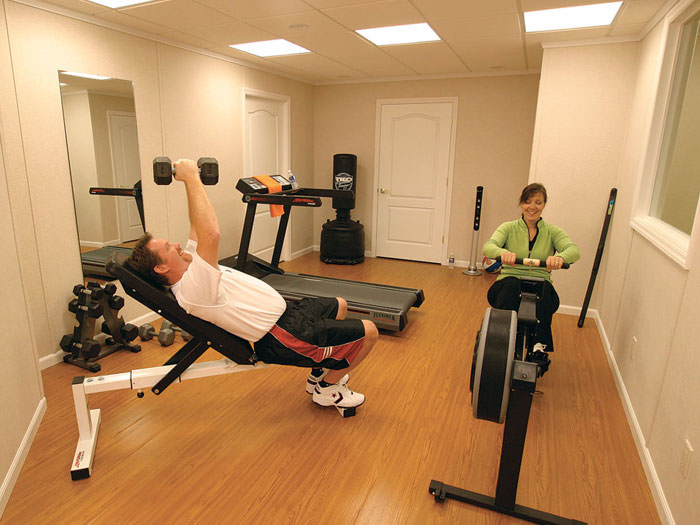 Wood Laminate Basement Floor Finishing Bangor Portland Rochester A Basement Gym And Workout Room With Wood Laminate Flooring Installed In Portsmouth