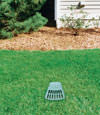 A buried gutter drain downspout extension installed in a Falmouth home