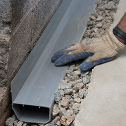 installing a drain tile system in a Ellsworth home